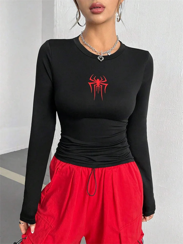 Women's long-sleeve spider crop top fabric detail — Vagabane Arachnita