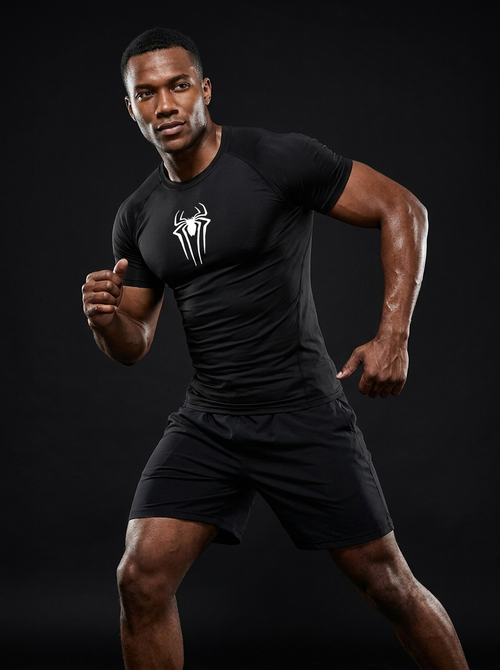 Athletic male model wearing Vagabane Arachnito spider print compression tank top — studio campaign shot
